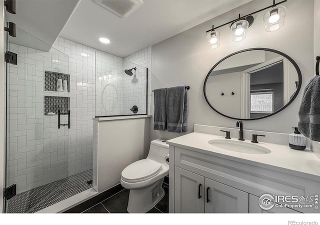 5609 Mount Sanitas Ave, Longmont, CO 80503 - full bathroom with toilet, tile patterned floors, vanity, a tile shower, and recessed lighting