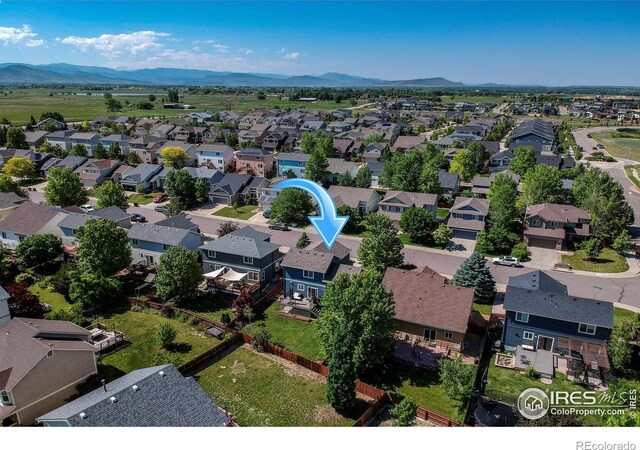 5609 Mount Sanitas Ave, Longmont, CO 80503 - aerial perspective of suburban area with a mountain backdrop