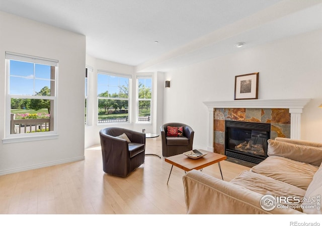 555 Laramie Blvd, Boulder, CO 80304 - living room featuring wood finished floors, a fireplace with flush hearth, and baseboards