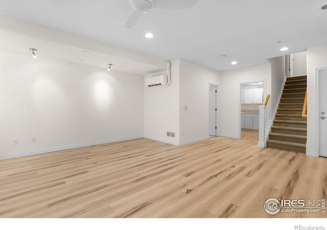 555 Laramie Blvd, Boulder, CO 80304 - unfurnished living room with a wall unit AC, stairs, light wood finished floors, baseboards, and recessed lighting