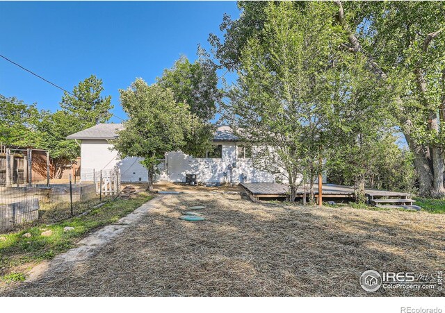 1498 Wicklow St, Boulder, CO 80303 - back of house with a wooden deck