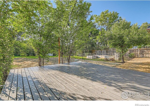 1498 Wicklow St, Boulder, CO 80303 - wooden deck with view of wooded area