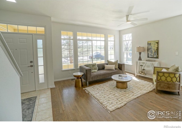 2855 Rock Creek Cir Unit 233, Superior, CO 80027 - living room featuring a ceiling fan and wood finished floors