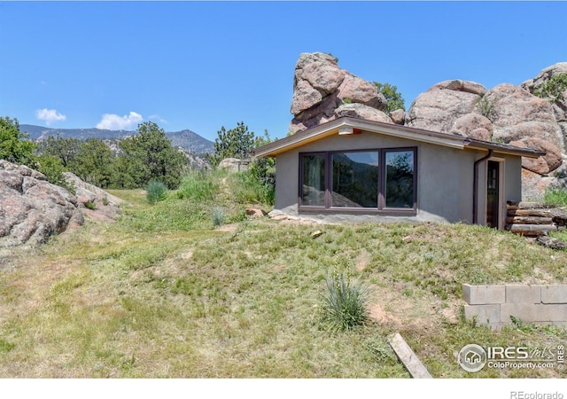 1960 Colard Ln, Lyons, CO 80540 - back of house featuring stucco siding and a mountain view