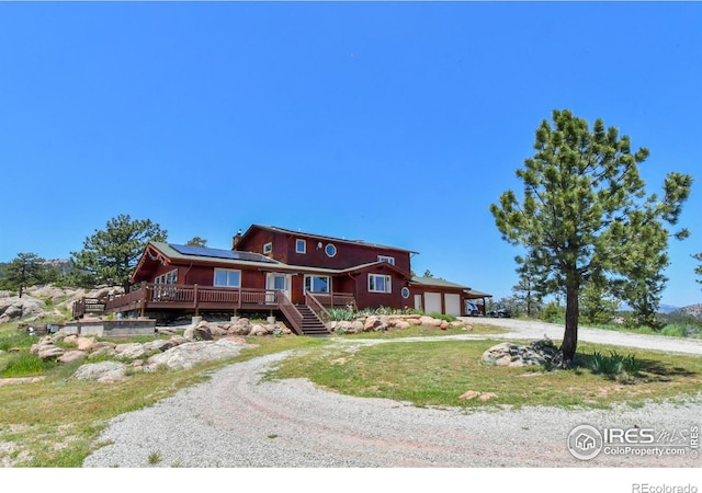 1960 Colard Ln, Lyons, CO 80540 - view of front of house with driveway, stairs, a garage, and a deck