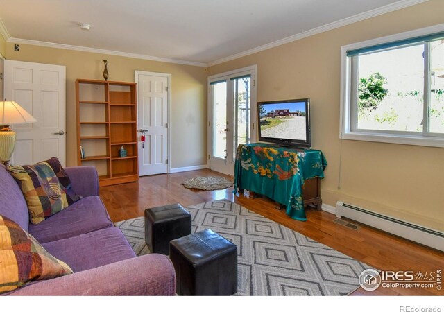 1960 Colard Ln, Lyons, CO 80540 - living room with healthy amount of natural light, a baseboard radiator, wood finished floors, and crown molding