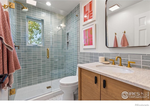 3490 16th St, Boulder, CO 80304 - bathroom featuring vanity, tile walls, a shower stall, and tile patterned flooring
