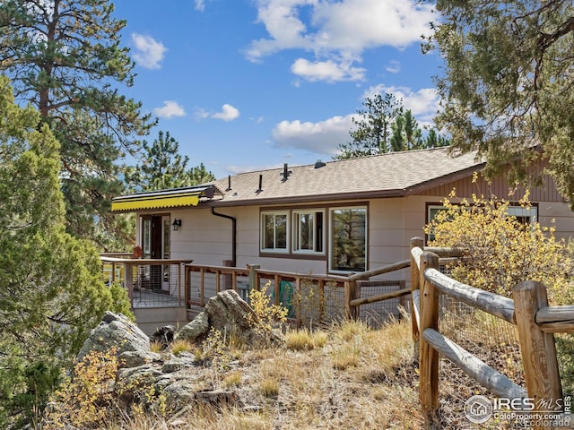621 Landers St, Estes Park, CO 80517 - back of property featuring a shingled roof and a deck