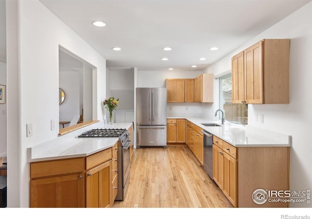 3635 Buckeye Ct, Boulder, CO 80304 - kitchen featuring stainless steel appliances, light wood-style flooring, light countertops, and recessed lighting