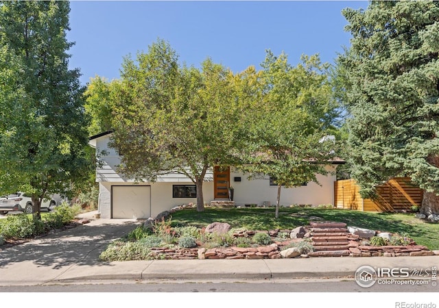3635 Buckeye Ct, Boulder, CO 80304 - obstructed view of property with asphalt driveway and an attached garage