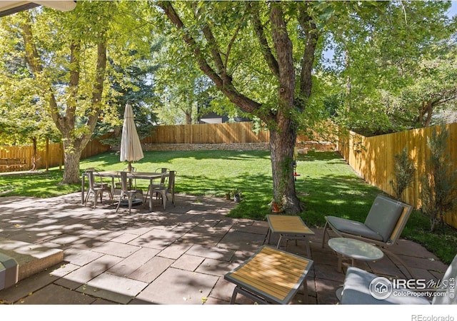 3635 Buckeye Ct, Boulder, CO 80304 - fenced backyard with a patio area and outdoor dining space