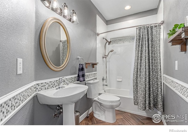 1451 Red Fox Cir, Severance, CO 80550 - full bathroom with shower / tub combo with curtain, wainscoting, and a textured wall