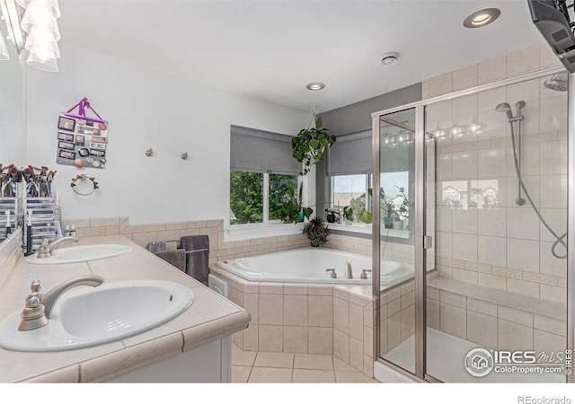 1451 Red Fox Cir, Severance, CO 80550 - full bathroom featuring a stall shower, a bath, tile patterned flooring, double vanity, and recessed lighting