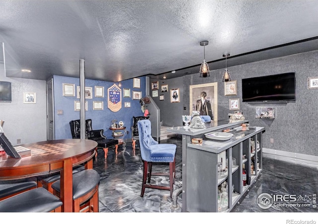 1451 Red Fox Cir, Severance, CO 80550 - bar area with finished concrete floors and a textured ceiling
