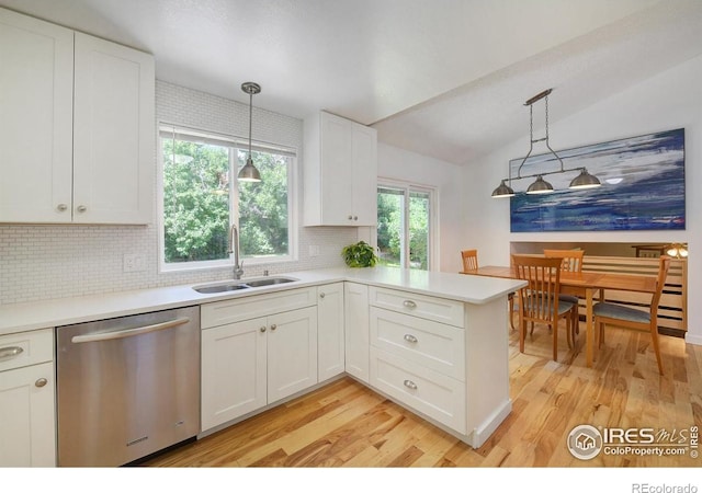 137 S Polk Ave, Louisville, CO 80027 - kitchen featuring dishwasher, tasteful backsplash, light wood-type flooring, white cabinets, and light countertops