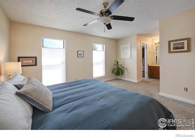 137 S Polk Ave, Louisville, CO 80027 - bedroom with carpet, a textured ceiling, a ceiling fan, and ensuite bathroom