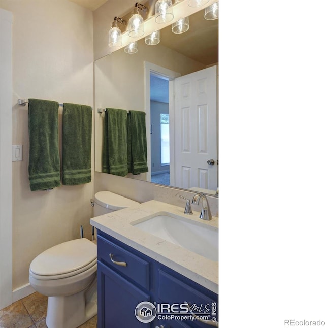 137 S Polk Ave, Louisville, CO 80027 - half bathroom featuring vanity and tile patterned floors