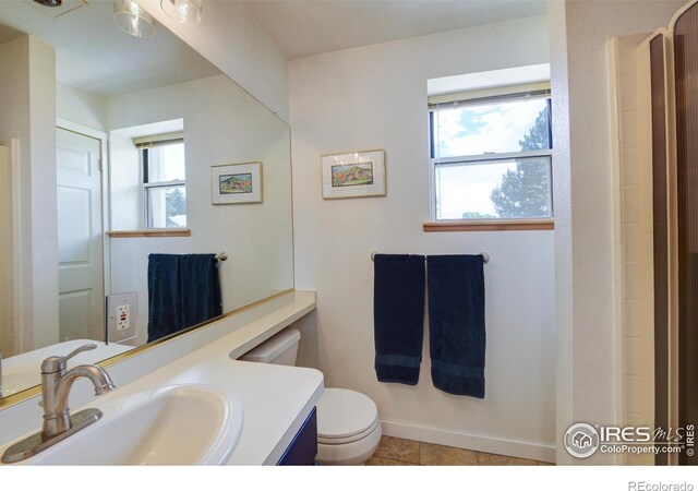 137 S Polk Ave, Louisville, CO 80027 - bathroom with healthy amount of natural light, vanity, and tile patterned floors
