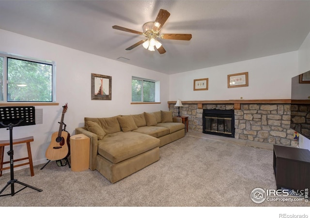 137 S Polk Ave, Louisville, CO 80027 - living area with carpet flooring, ceiling fan, plenty of natural light, and a fireplace