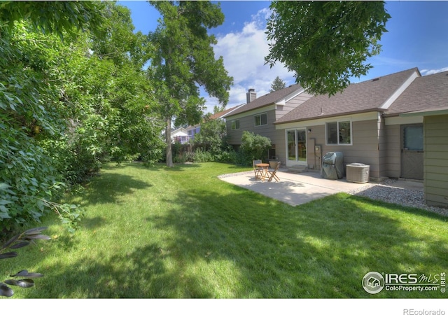 137 S Polk Ave, Louisville, CO 80027 - view of grassy yard featuring a patio