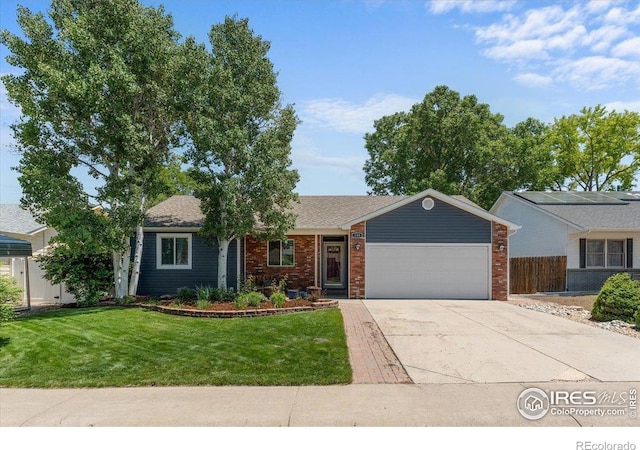 110 50th Ave, Greeley, CO 80634 - ranch-style home featuring an attached garage, driveway, and brick siding