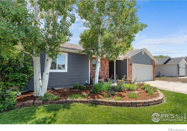 110 50th Ave, Greeley, CO 80634 - view of front facade featuring an attached garage, driveway, a front lawn, and brick siding