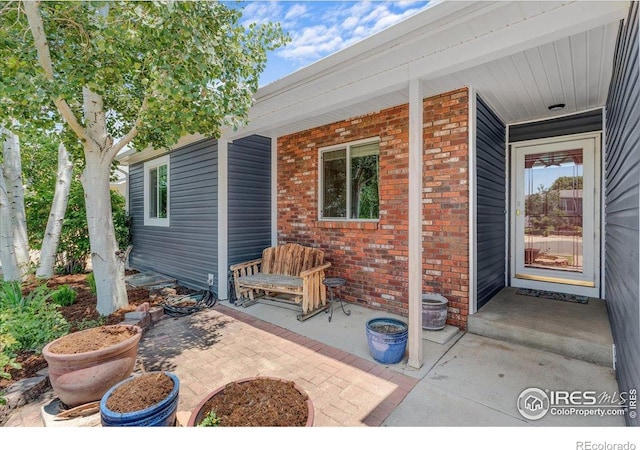 110 50th Ave, Greeley, CO 80634 - doorway to property featuring brick siding