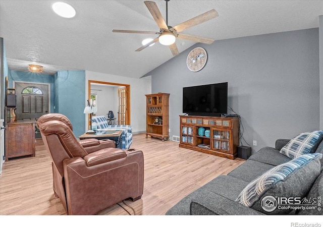 110 50th Ave, Greeley, CO 80634 - living area with a ceiling fan, wood finished floors, a textured ceiling, and vaulted ceiling