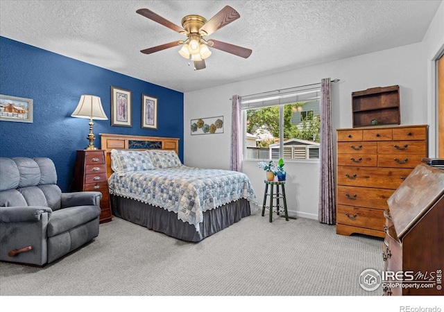 110 50th Ave, Greeley, CO 80634 - bedroom with carpet flooring, a textured ceiling, and ceiling fan