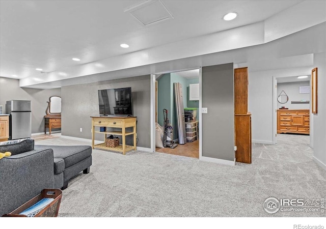 110 50th Ave, Greeley, CO 80634 - carpeted living area featuring baseboards and recessed lighting