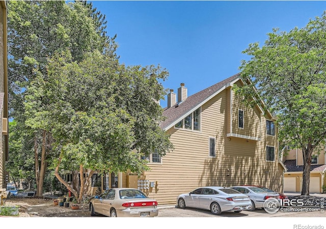 4771 White Rock Cir Unit B, Boulder, CO 80301 - view of front of home featuring a chimney