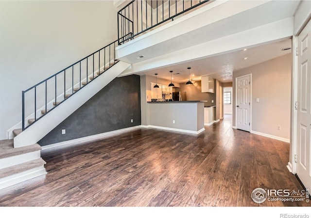 4771 White Rock Cir Unit B, Boulder, CO 80301 - unfurnished living room with wood finished floors and stairway
