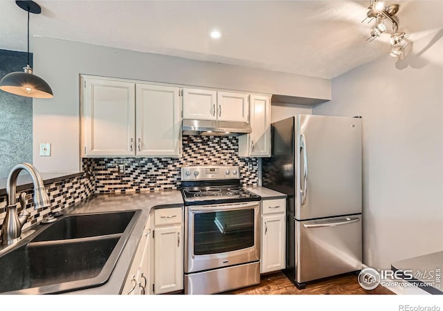 4771 White Rock Cir Unit B, Boulder, CO 80301 - kitchen with appliances with stainless steel finishes, under cabinet range hood, and white cabinetry