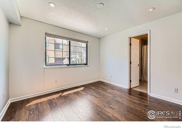 4771 White Rock Cir Unit B, Boulder, CO 80301 - spare room with hardwood / wood-style floors, a textured ceiling, and recessed lighting