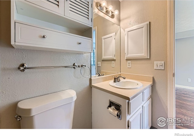 4771 White Rock Cir Unit B, Boulder, CO 80301 - bathroom featuring vanity, wood finished floors, and a textured wall