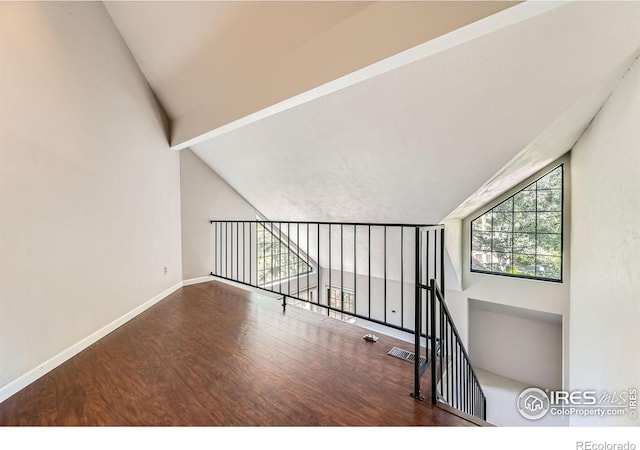 4771 White Rock Cir Unit B, Boulder, CO 80301 - unfurnished room with wood finished floors and lofted ceiling