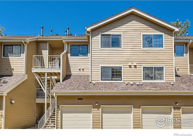 4771 White Rock Cir Unit B, Boulder, CO 80301 - view of building exterior featuring an attached garage and stairs