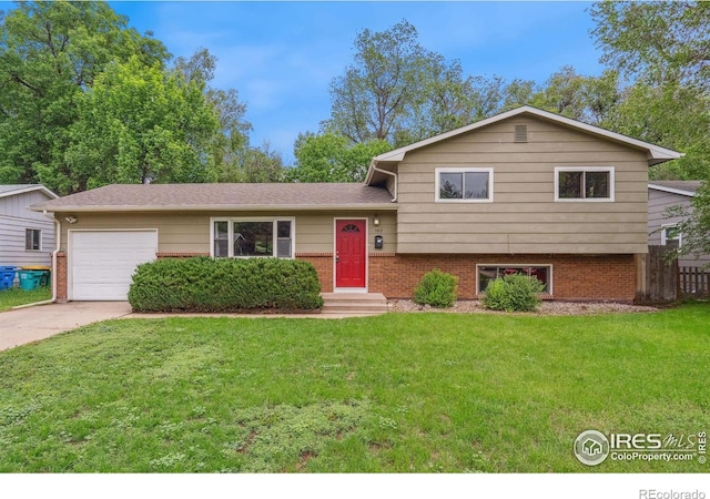 1512 Brentwood Dr, Fort Collins, CO 80521 - split level home with an attached garage, concrete driveway, and brick siding