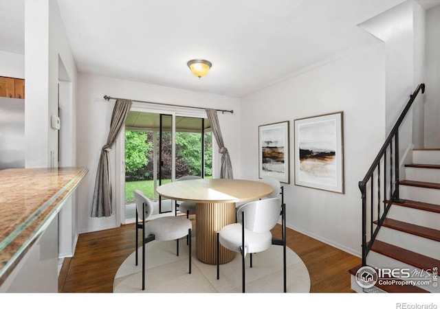 1512 Brentwood Dr, Fort Collins, CO 80521 - dining space with wood finished floors and stairs