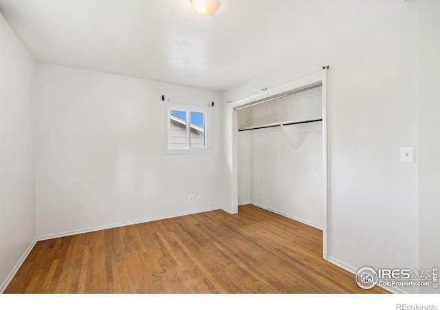 1512 Brentwood Dr, Fort Collins, CO 80521 - unfurnished bedroom featuring wood finished floors and a closet