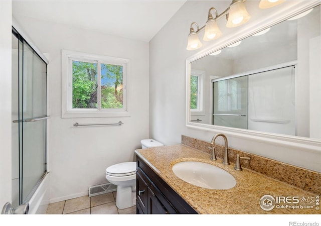 1512 Brentwood Dr, Fort Collins, CO 80521 - bathroom with vanity, tile patterned floors, and enclosed tub / shower combo
