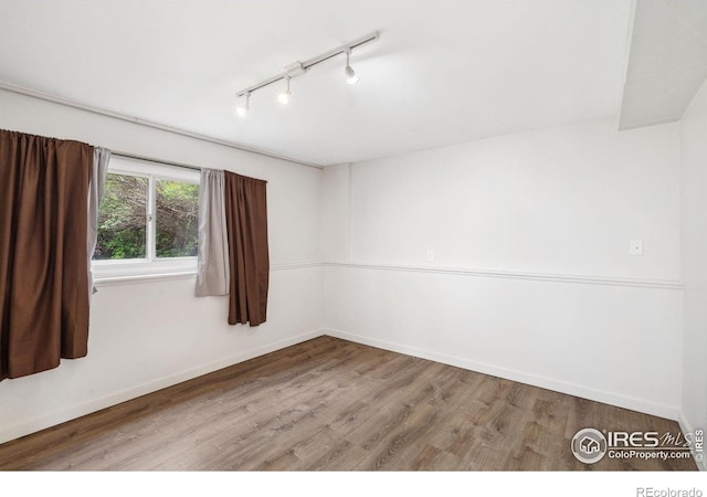 1512 Brentwood Dr, Fort Collins, CO 80521 - unfurnished room with rail lighting and wood finished floors