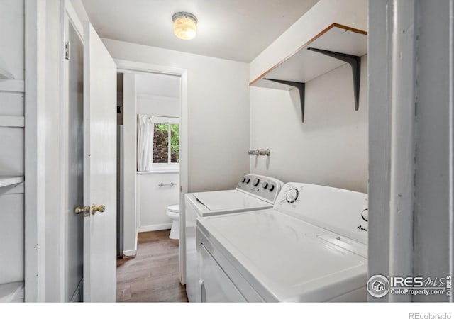 1512 Brentwood Dr, Fort Collins, CO 80521 - laundry area with washer and dryer and light wood finished floors