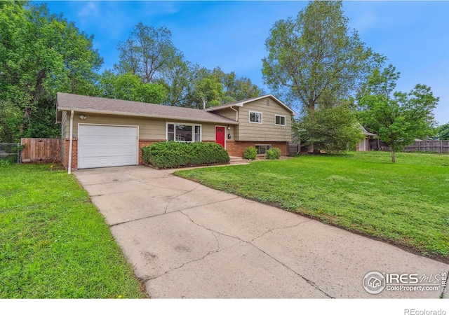 1512 Brentwood Dr, Fort Collins, CO 80521 - tri-level home featuring brick siding, an attached garage, and driveway