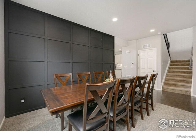 6420 Tuxedo Park Rd, Timnath, CO 80547 - dining area featuring a decorative wall, recessed lighting, and stairway