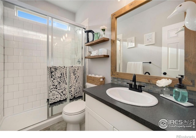6420 Tuxedo Park Rd, Timnath, CO 80547 - full bath featuring a shower stall, vanity, and tasteful backsplash
