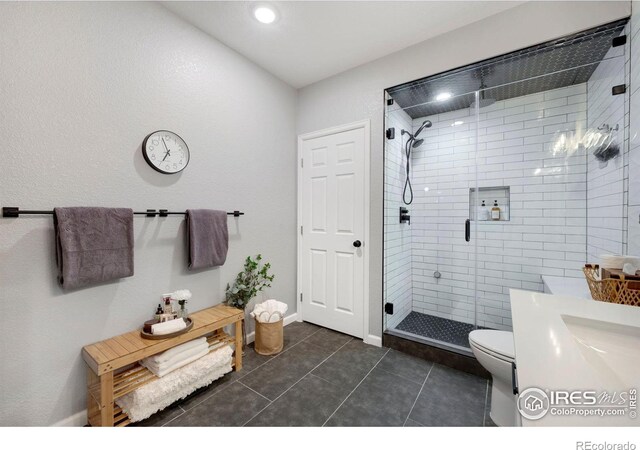 6420 Tuxedo Park Rd, Timnath, CO 80547 - full bath with a stall shower, tile patterned flooring, vanity, and recessed lighting