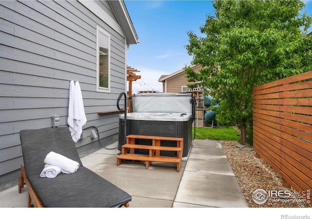 6420 Tuxedo Park Rd, Timnath, CO 80547 - view of patio / terrace with a hot tub