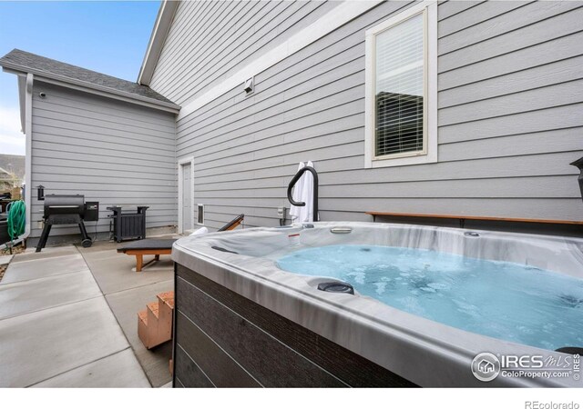 6420 Tuxedo Park Rd, Timnath, CO 80547 - view of patio / terrace featuring a hot tub