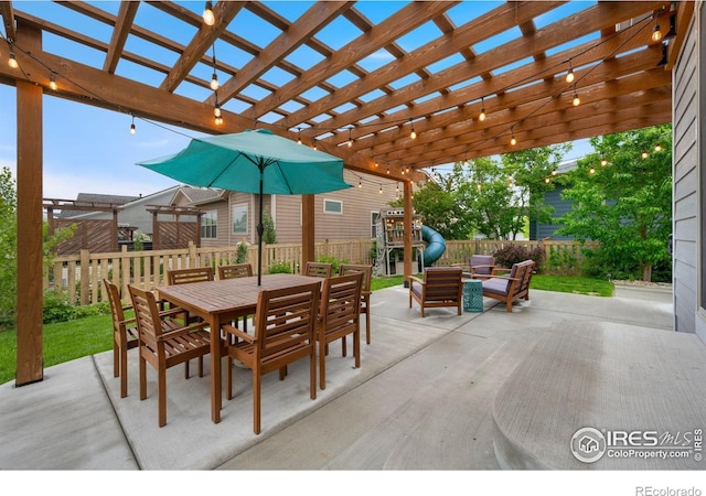 6420 Tuxedo Park Rd, Timnath, CO 80547 - fenced backyard with a patio, outdoor dining space, and a pergola